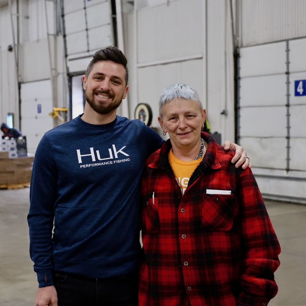Rich poses with MOFC Distribution Specialist Angie Hafner in the warehouse