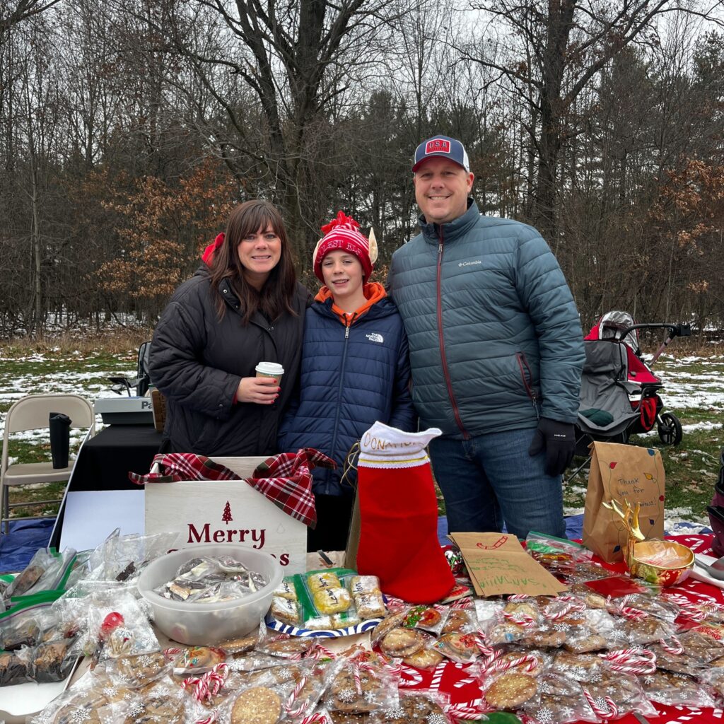 Vinny stands alongside his mom and dad